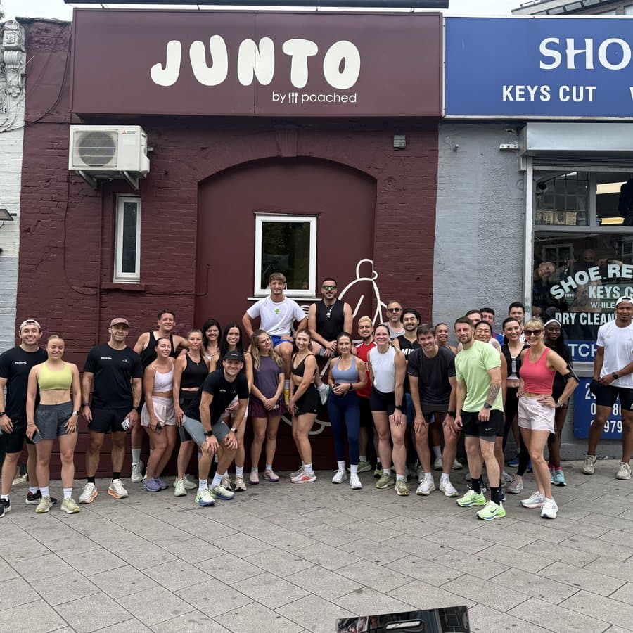 A big group of runners gathered outside Junto cafe before a PacePal run